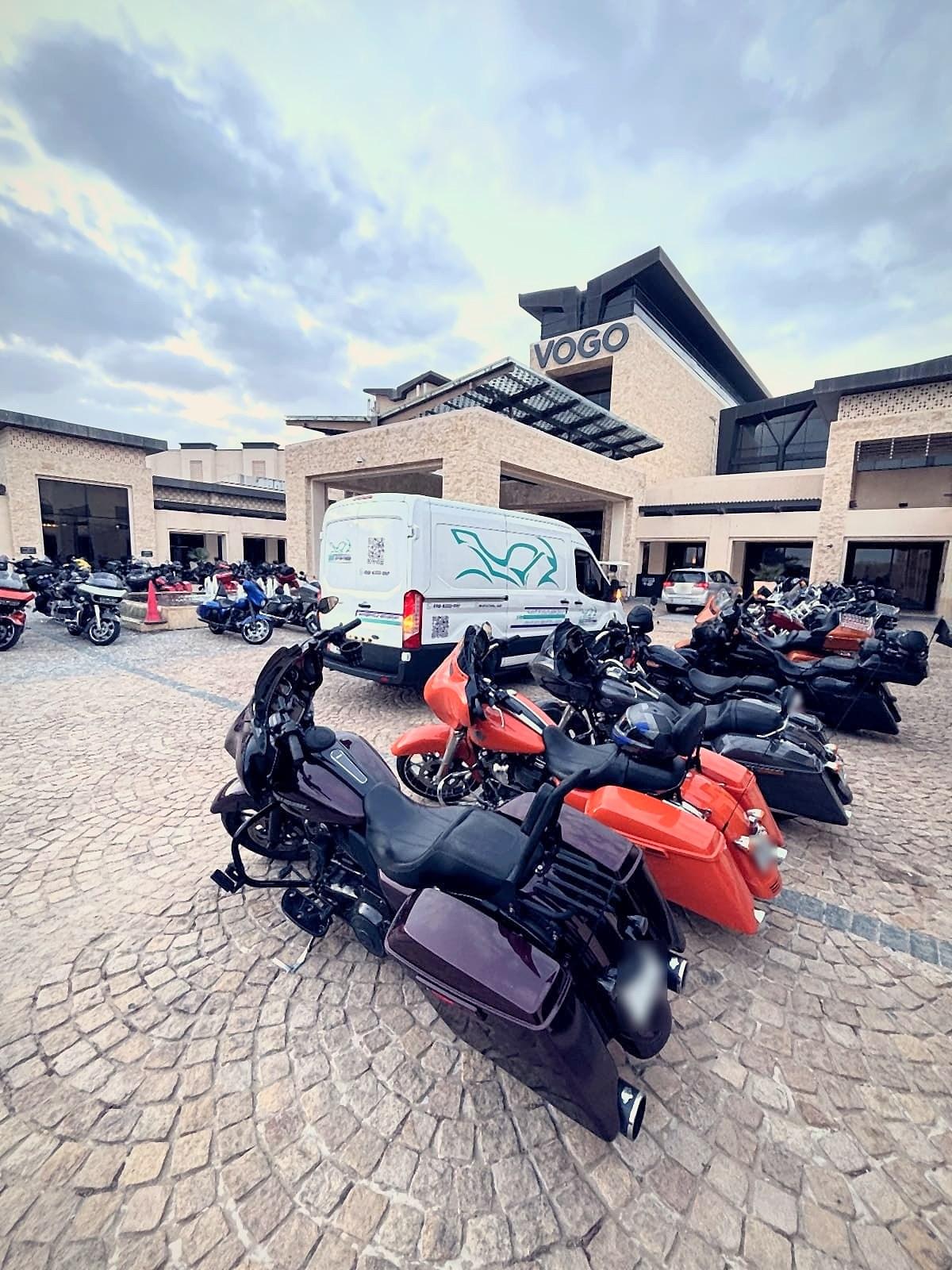 The MC Station van among Harley-Davidsons at a group ride